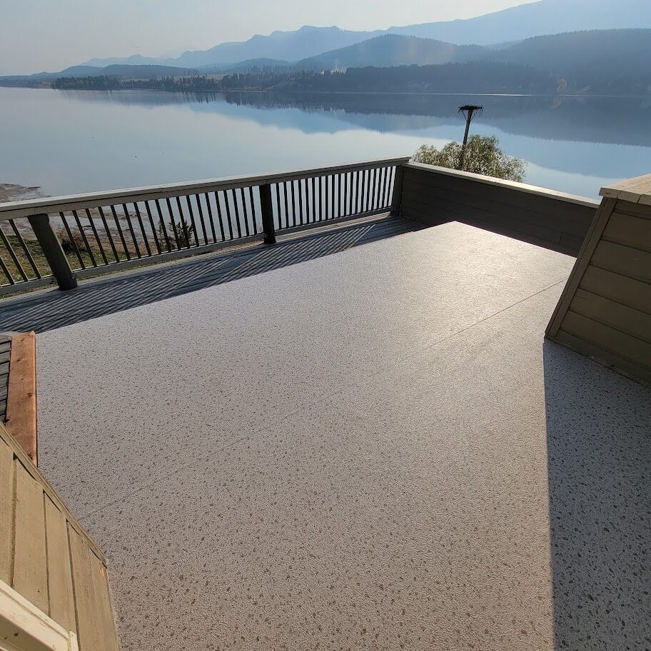 Durable vinyl decking installation in Invermere with a lake and mountain view
