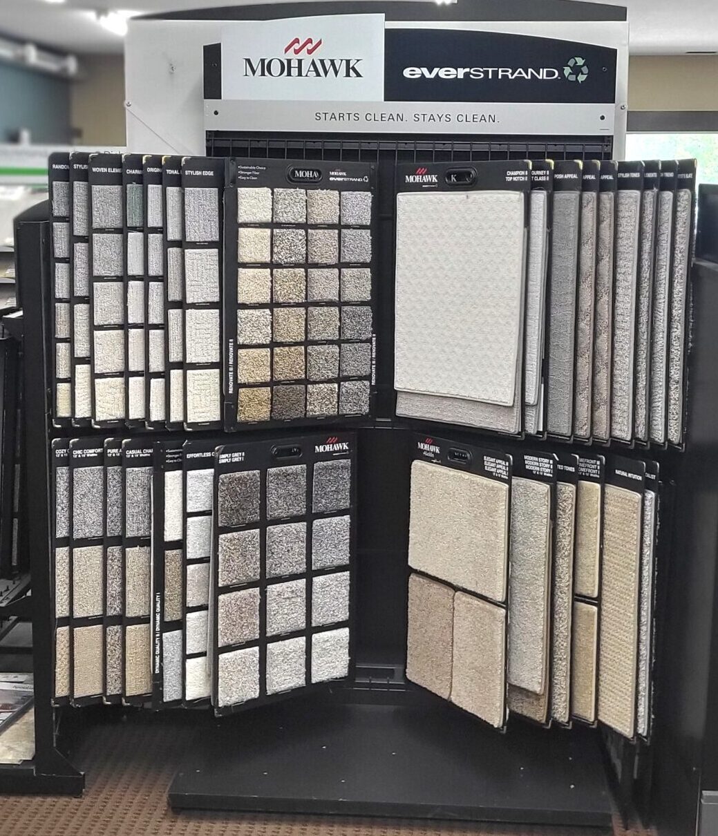 Display rack of Mohawk EverStrand carpet samples in various colors and textures at the Warwick Interiors showroom in Invermere, BC.