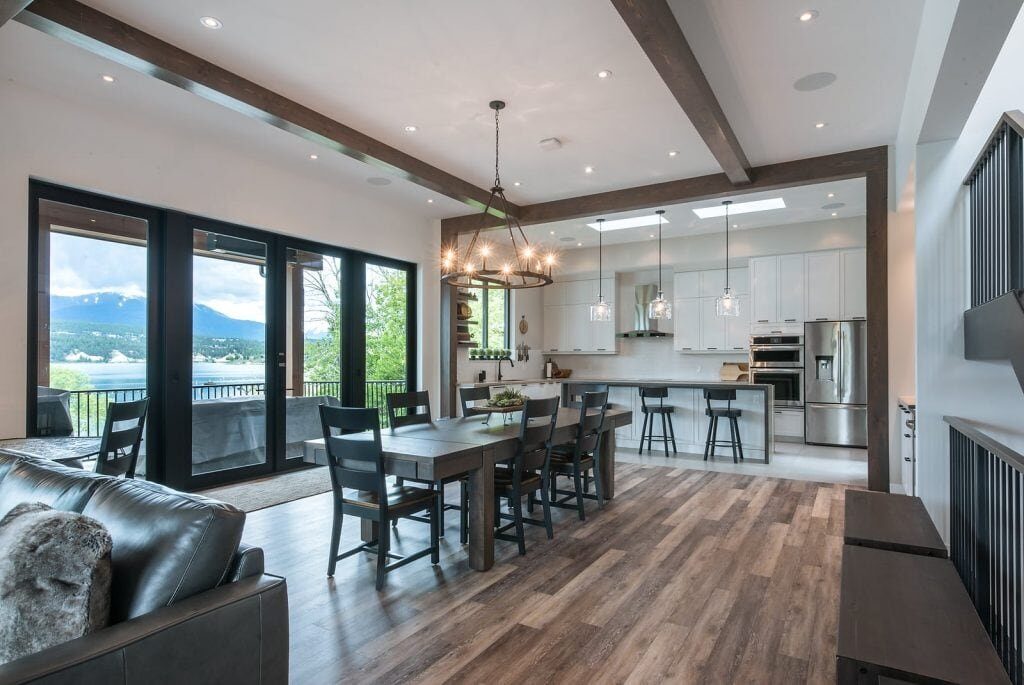 uxury vinyl plank (LVP) flooring in open-concept kitchen and dining, installed by Warwick Interiors, Invermere BC.”